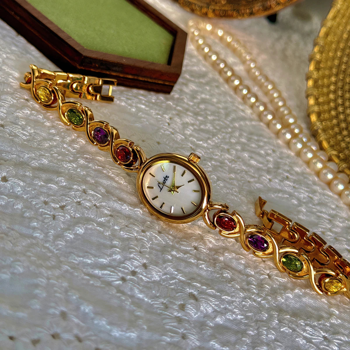 High-End Women’s Watch with Colorful Tourmalines, Diamonds, and an Oval Mother-of-Pearl Dial